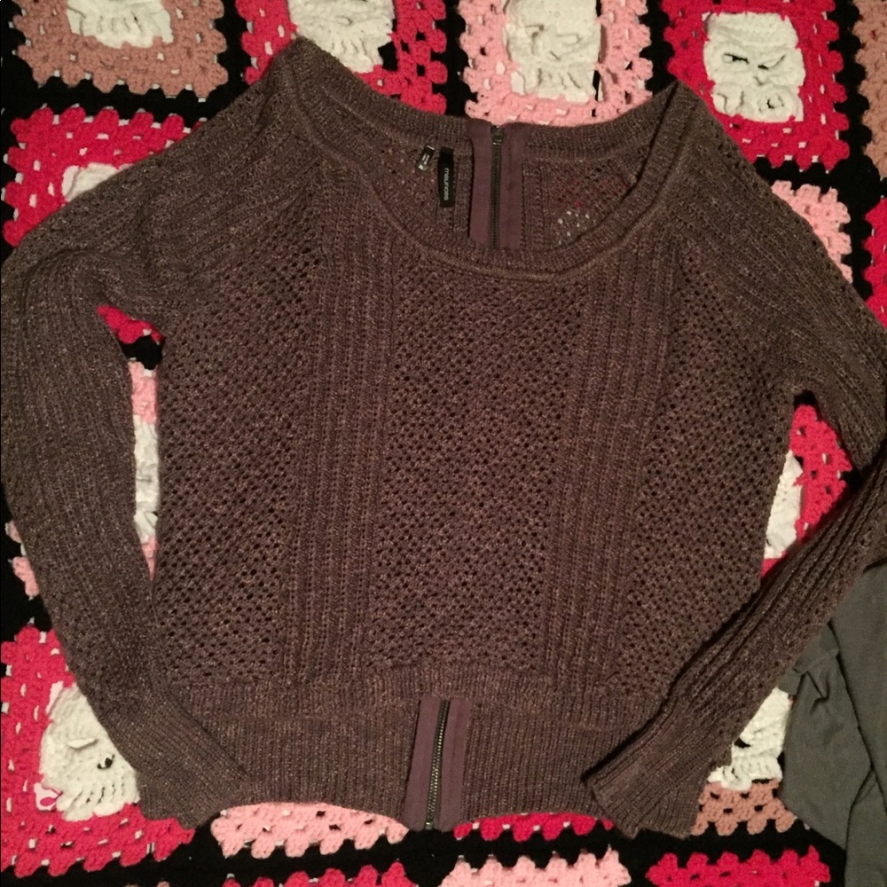 Nice sweater with working zipper up the back.